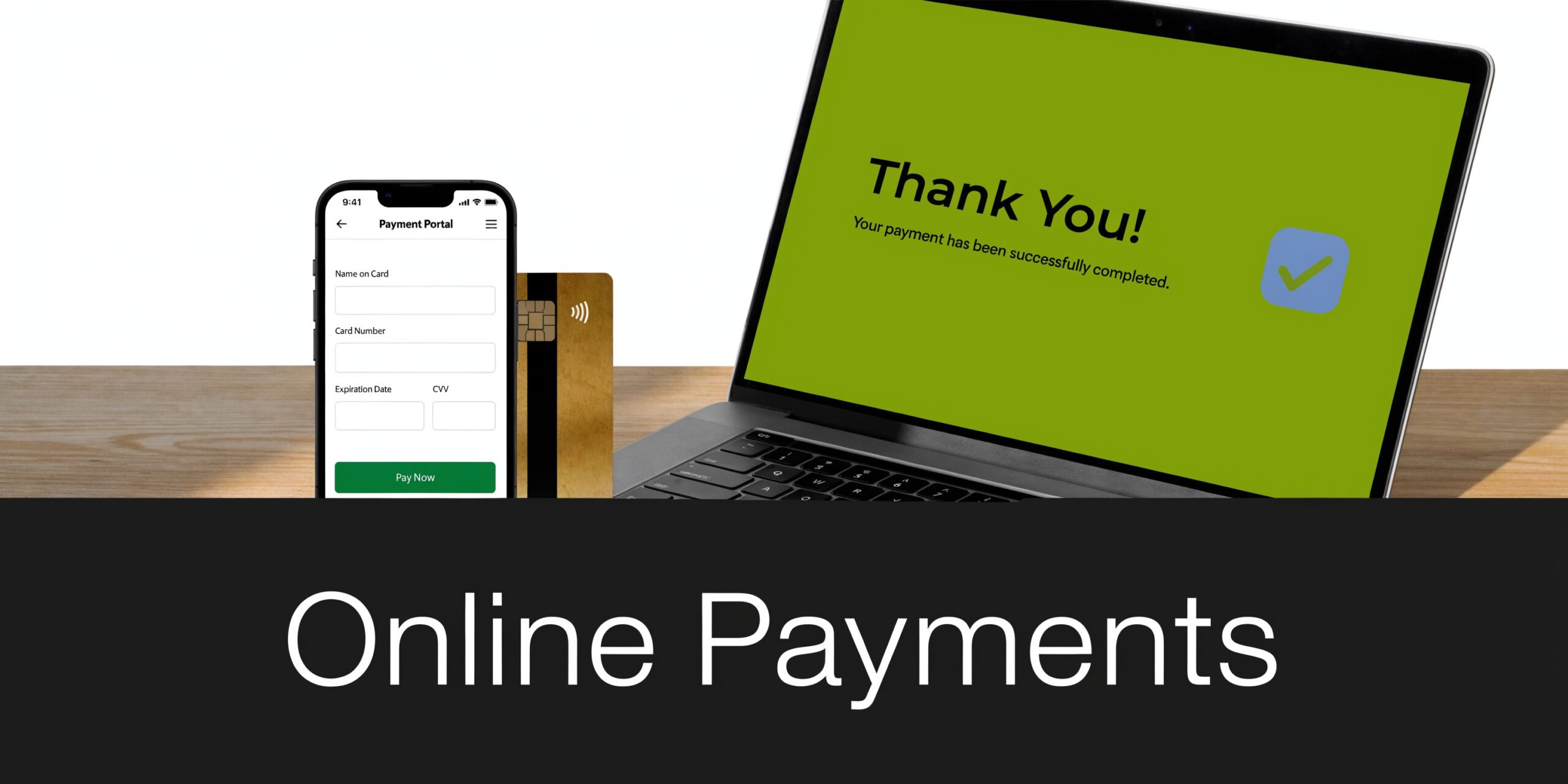 A laptop and smartphone displaying a successful online payment transaction alongside a credit card on a desk.